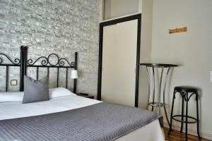 Posteľ alebo postele v izbe v ubytovaní Hostal Mainz