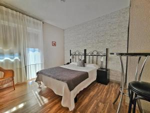 Posteľ alebo postele v izbe v ubytovaní Hostal Mainz