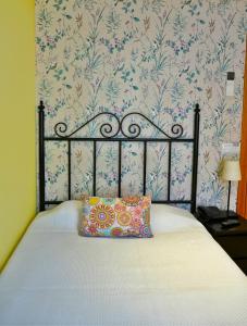 Posteľ alebo postele v izbe v ubytovaní Hostal Mainz