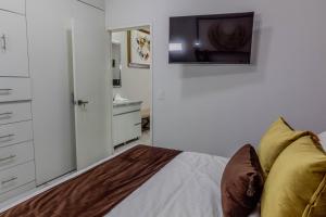 TV a/nebo společenská místnost v ubytování Exclusiva suite en el centro de Zapotlanejo 205