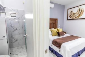 Postel nebo postele na pokoji v ubytování Exclusiva suite en el centro de Zapotlanejo 205