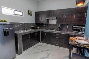 Kuchyň nebo kuchyňský kout v ubytování Exclusiva suite en el centro de Zapotlanejo 205