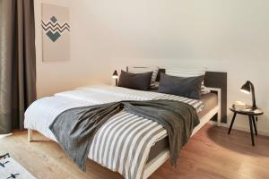 Postel nebo postele na pokoji v ubytování Ferienhaus Backsteinquartier C Putbus