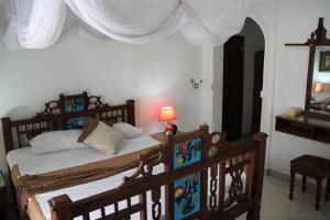 Rúm í herbergi á Al-Minar Hotel