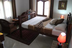 Rúm í herbergi á Al-Minar Hotel