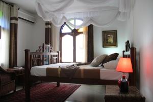 Rúm í herbergi á Al-Minar Hotel