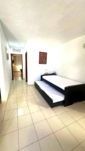 a bedroom with a bed and a hallway at María Hosting 304 in Santa Marta