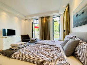 TV/trung tâm giải trí tại Ferienwohnung Luxus Apartment Küstenblick Sellin