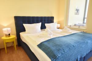 Кровать или кровати в номере Ferienwohnung "Seestern" in der Villa Odin Sellin