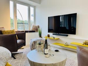 Et tv og/eller underholdning på Ferienwohnung Leuchtfeuer im Haus Zudar Prora