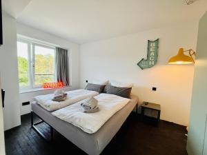 Postel nebo postele na pokoji v ubytování Ferienwohnung Marepineta im Haus Zudar Prora