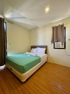 Postel nebo postele na pokoji v ubytování Hotel Elegant La Union