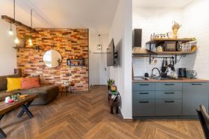 a living room with a couch and a kitchen at Gora Apartments 3 in Vrdnik +13 photos