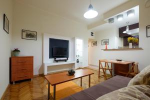 a living room with a couch and a table at M&M Downtown Apartment in Belgrade