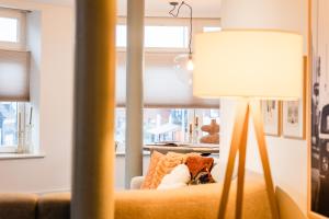 En eller flere senge i et værelse på Reffel Suites