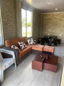 a living room with a couch and a table at El Rincón de Charito in Tumaco