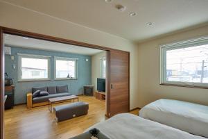 Postel nebo postele na pokoji v ubytování Go Home 豪