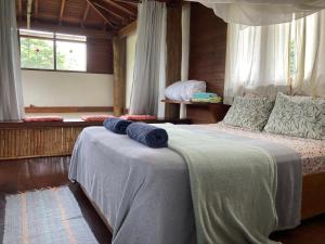 Postel nebo postele na pokoji v ubytování CASA Ecológica Paraty
