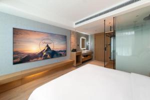 Posteľ alebo postele v izbe v ubytovaní Qiuguo Hotel Chongqing Guanyin Bridge Branch