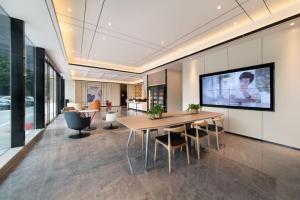 Televízia a/alebo spoločenská miestnosť v ubytovaní Qiuguo Hotel Chongqing Guanyin Bridge Branch + 37 fotografií