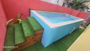a swimming pool on the side of a building at Tropical Paradise villa 1 in Ocho Rios
