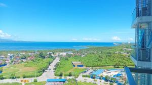 an aerial view of a city and the ocean at Mactan Newtown Condo near international Airport in Lapu Lapu City