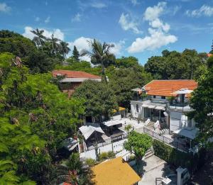 an aerial view of a house with trees at Gulangyu Sunlit Rock Garden Resort in Xiamen