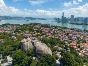 an aerial view of a city and a river at Gulangyu Sunlit Rock Garden Resort in Xiamen