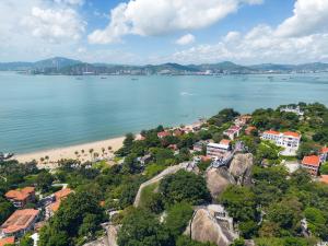an aerial view of a beach with houses and buildings at Gulangyu Sunlit Rock Garden Resort in Xiamen