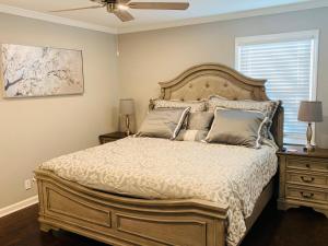 a bedroom with a large bed and a ceiling fan at Travelers Rest Treasure - Sleeps 8 - 3 Bedroom 2 Bath - Pets Welcome in Travelers Rest
