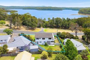 an aerial view of a house with a lake at 19 Mort Avenue - Dalmeny Lakeside in Dalmeny