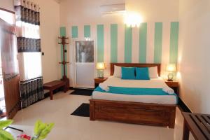 Voodi või voodid majutusasutuse Nilambara Lake View toas