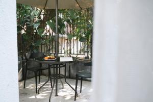 a table with a plate of food on it at Gulangyu Sunlit Rock Garden Resort in Xiamen