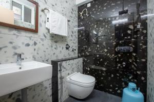 Koupelna v ubytování Hotel PRM Aruna Archadia