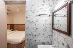 Koupelna v ubytování Hotel PRM Aruna Archadia