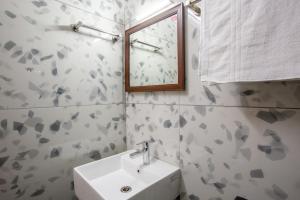Koupelna v ubytování Hotel PRM Aruna Archadia