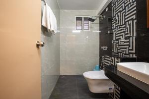 Koupelna v ubytování Hotel PRM Aruna Archadia