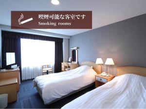 Silk Hotel Annex客房内的一张或多张床位