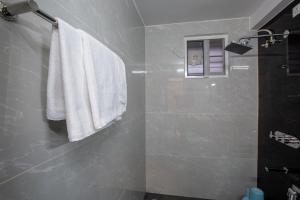Koupelna v ubytování Hotel PRM Aruna Archadia