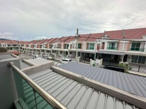arial view of a roof of a building with buildings at La Mensa Families Cheerful Residences in Ulu Melaka