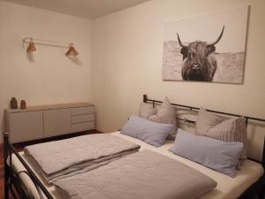 Ένα ή περισσότερα κρεβάτια σε δωμάτιο στο Ferienwohnung Auszeit