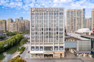 an aerial view of a tall white building at Metropolo, Shaoxing, Wanda Plaza-Keqiao in Shaoxing