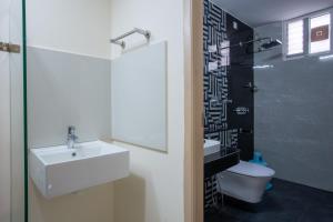Koupelna v ubytování Hotel PRM Aruna Archadia