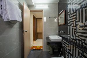 Koupelna v ubytování Hotel PRM Aruna Archadia