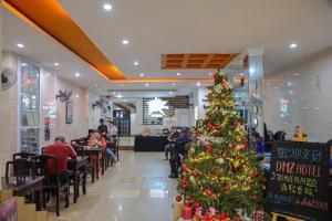 a christmas tree in the middle of a restaurant at DMZ Hotel ,Central Hue ,Near Perfume River in Hue
