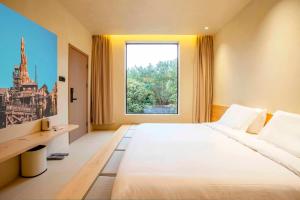 Postel nebo postele na pokoji v ubytování Shanghai Xingshe Camping B&B Disney Branch