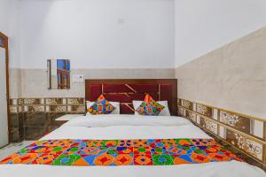 Krevet ili kreveti u jedinici u okviru objekta FabExpress Shree Siya Raman - 500m from Shri Ram Janam Bhumi