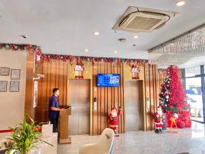 TV a/nebo společenská místnost v ubytování 广东大酒店Guangdon Business Hotel-SM Mall of Asia, SMX & Manila World Trade Center