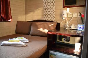 Un pat sau paturi într-o cameră la Everest Hostel