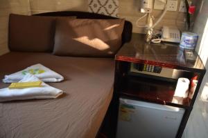 Un pat sau paturi într-o cameră la Everest Hostel